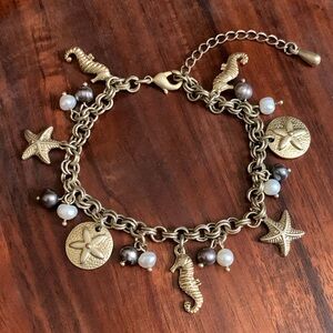 Gold tone nautical theme bracelet